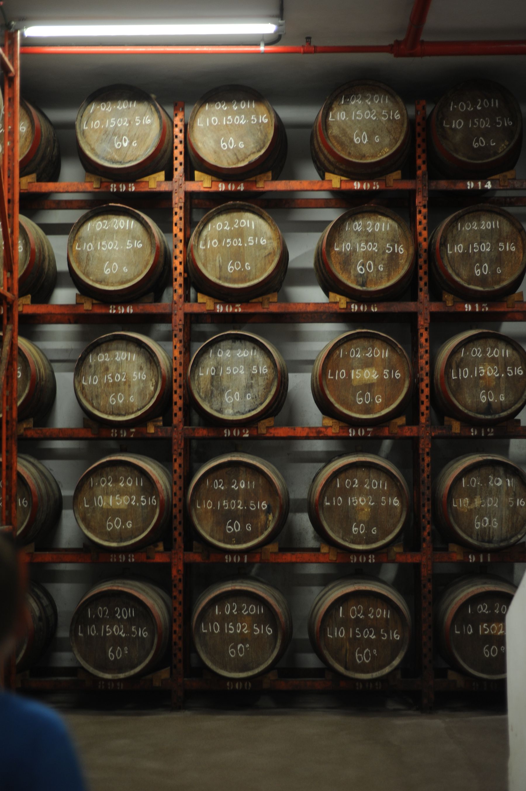 Whisky casks stacked in a working maturation warehouse